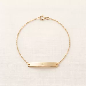 Gold chain bracelet with an engraved initial bar