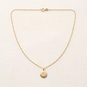 Gold disc charm engraved with the letter L on a fine chain
